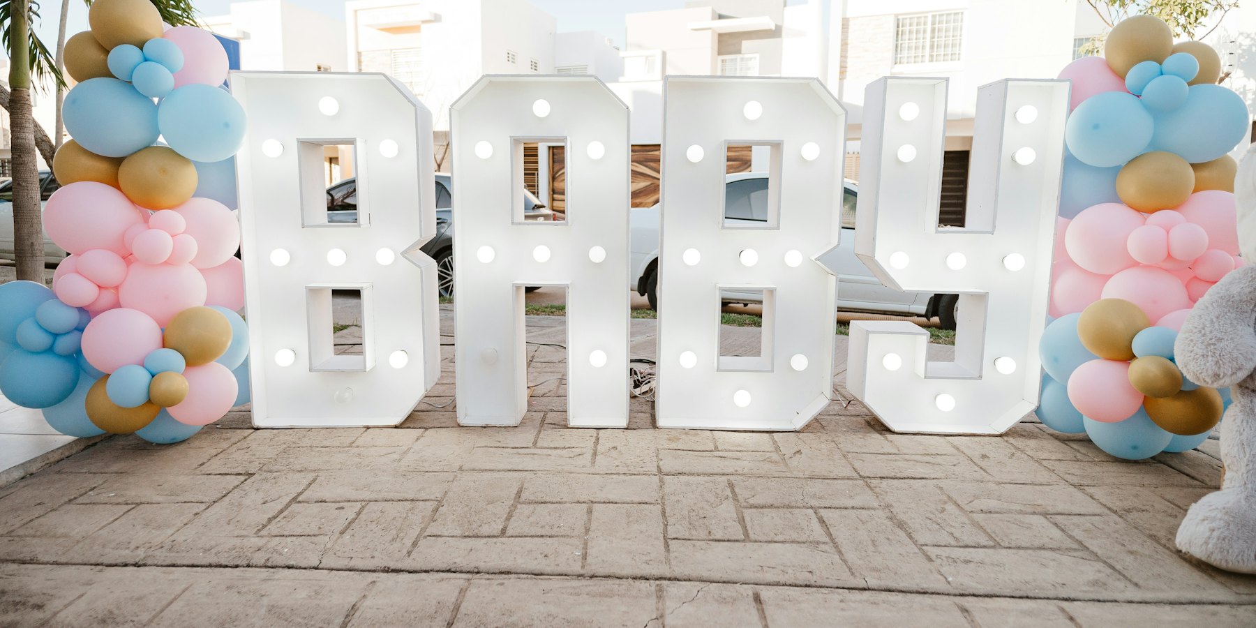 Baby shower decorations with balloons and big BABY letters