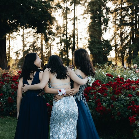 Friends in formal dresses before the school formal