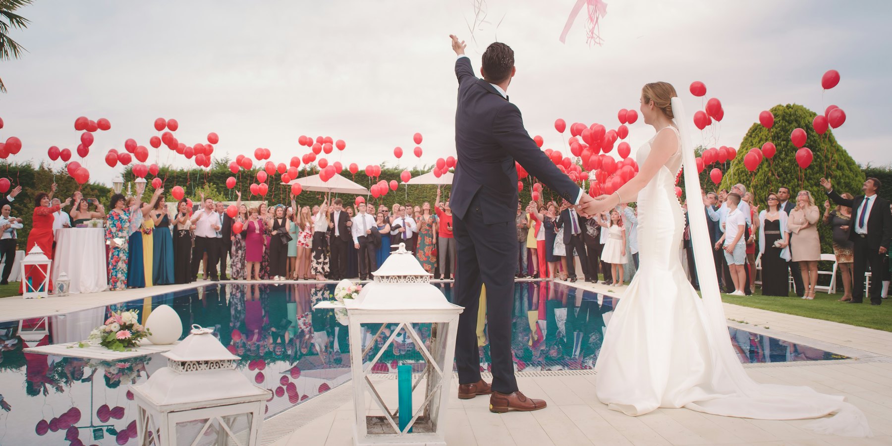 Newlyweds celebrating as they leave their wedding